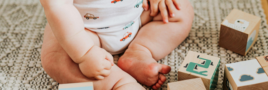 Our Favorite Baby Sitting Hack: Fun Laundry Basket Activities for Independent Sitting