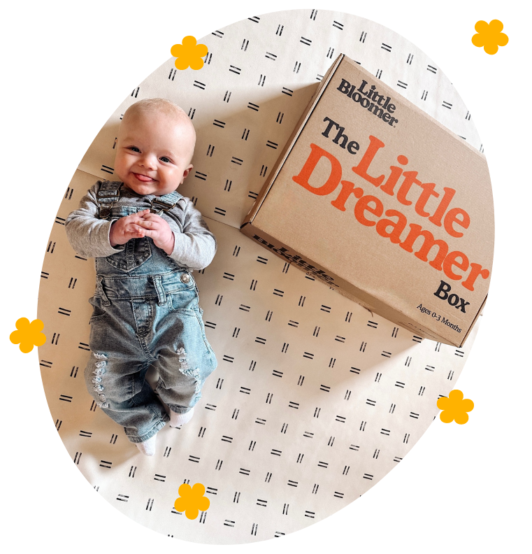 happy baby with Little Dreamer newborn developmental toy subscription box by Little Bloomer